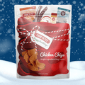 Bag of Farm to Pet Chicken Chips dog treats with a snowy background