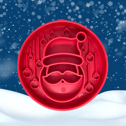 Red Santa Claus cookie cutter on a snowy background