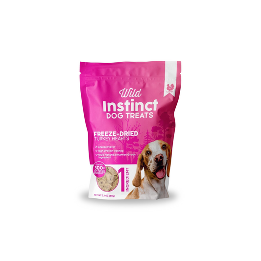 Pink package of Wild Instinct Dog Treats with a dog on the label