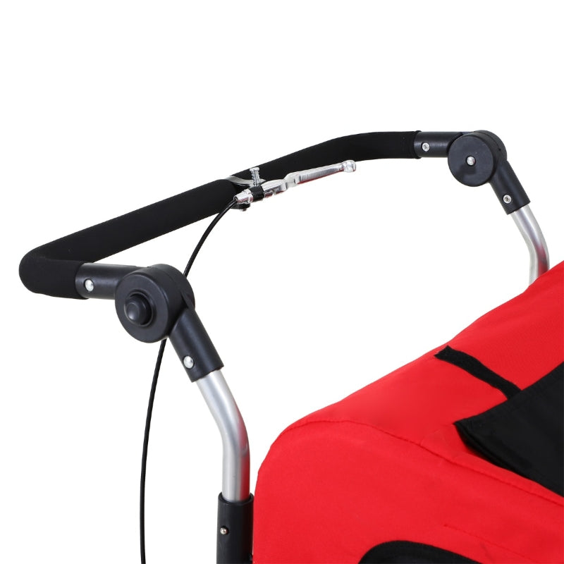 Close-up of a red stroller with black handlebar and seat