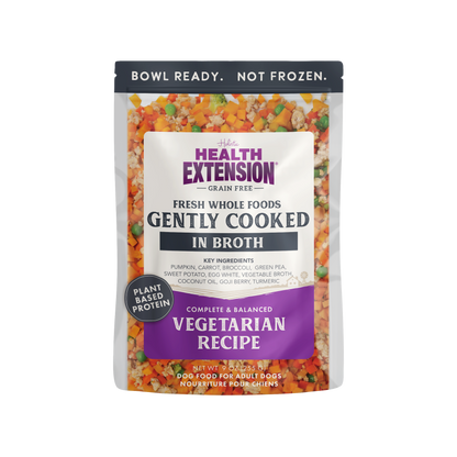 Health Extension dog food pouch with colorful ingredients on a white background
