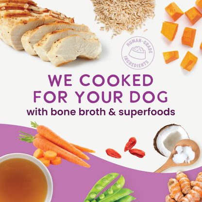 Dog food packaging with ingredients like chicken, carrots, and superfoods on a white and purple background.