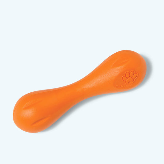 Orange dog toy with a paw print on a light gray background