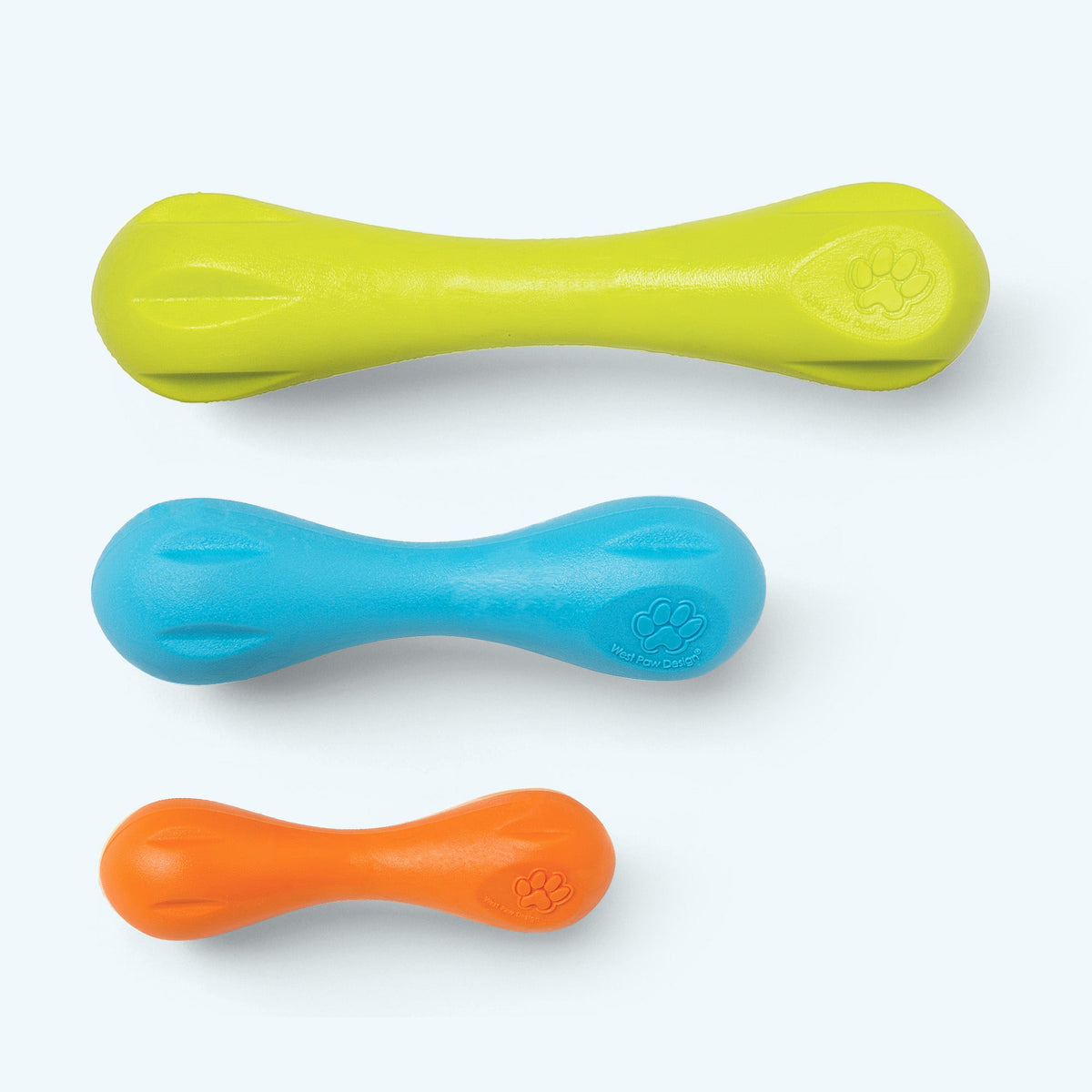 Three dog toys in green, blue, and orange on a white background