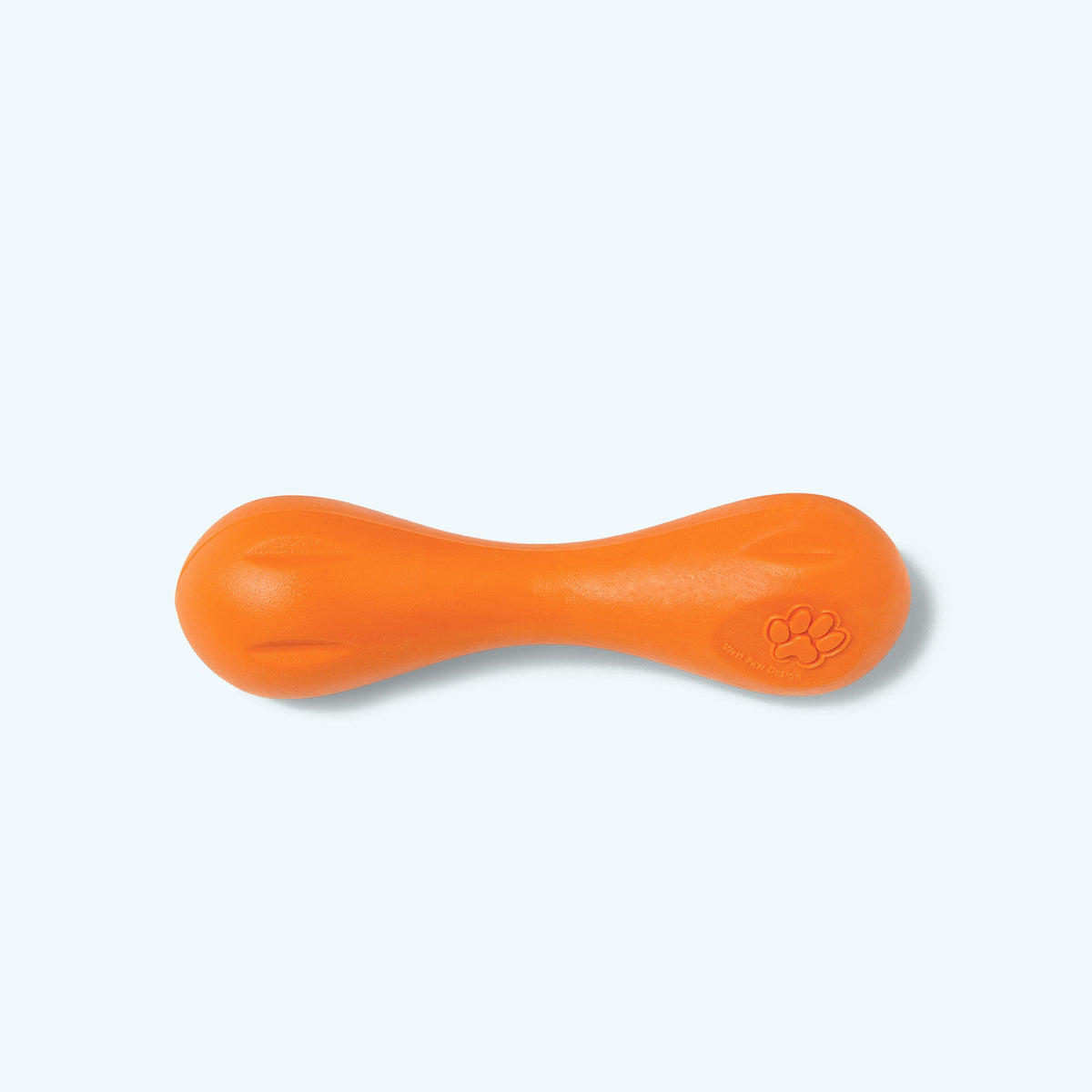 Orange dog toy with a paw print on a white background