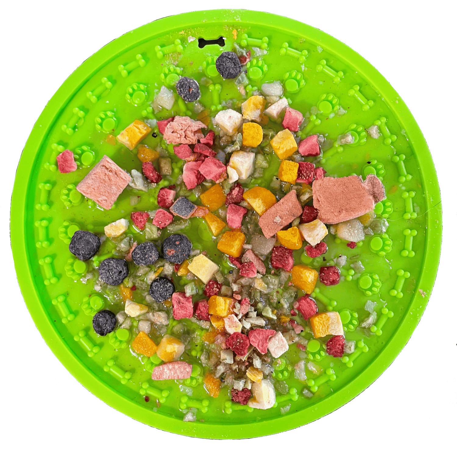 Green pet food puzzle mat with various dog treats on a white background