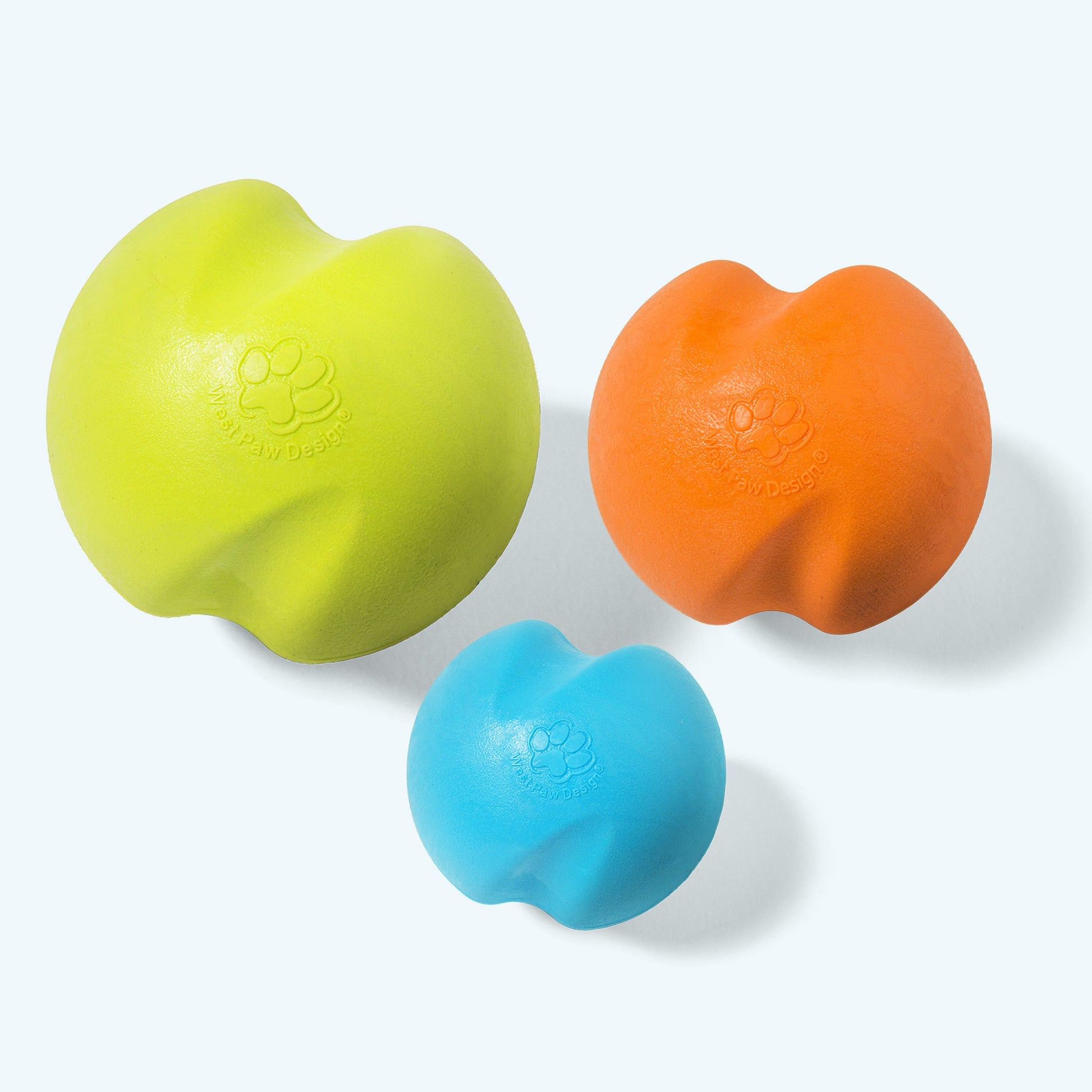 Three colorful rubber balls on a white background
