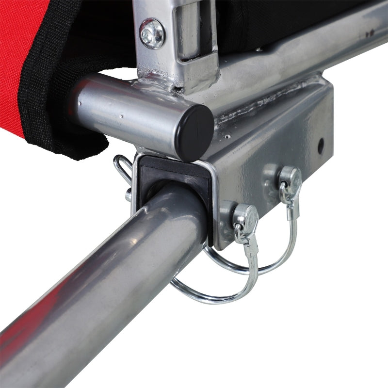 Close-up of a metal bracket and cylindrical component on a white background