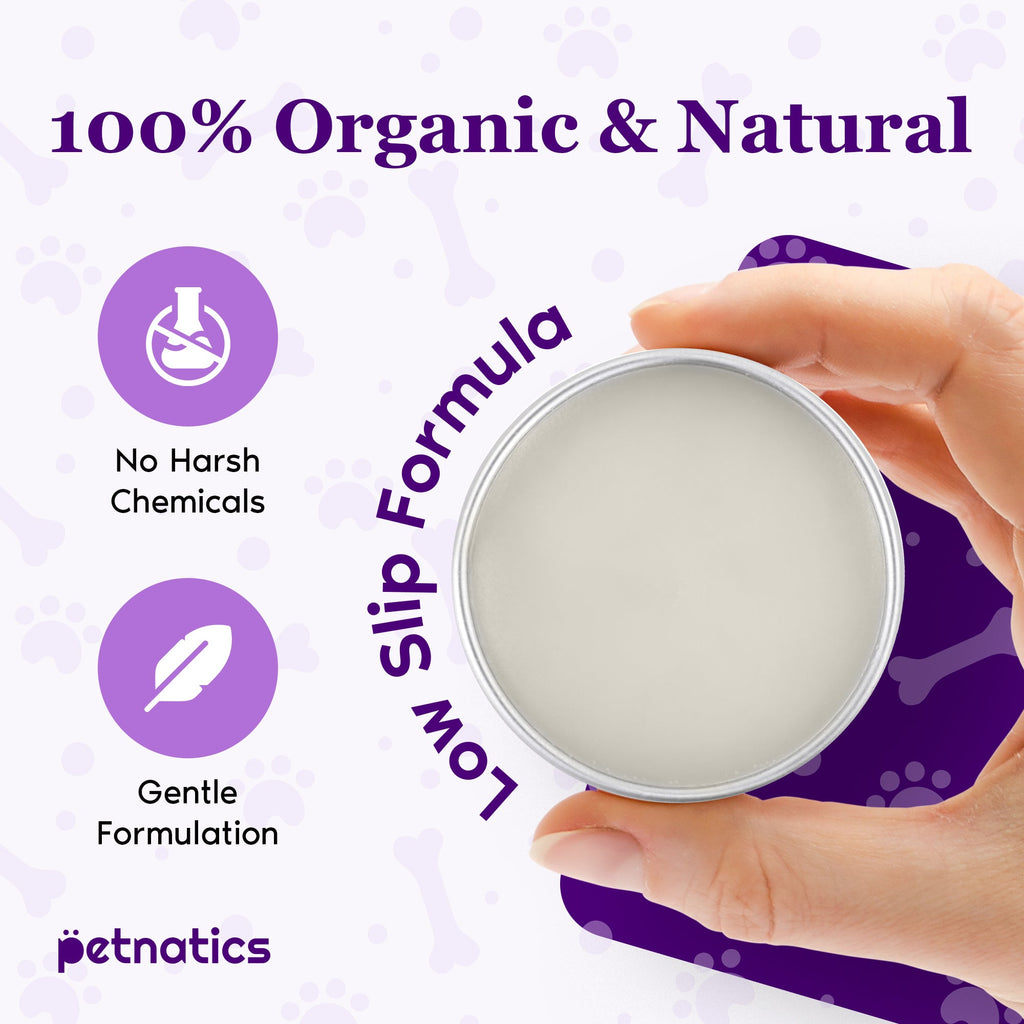 Hand holding a container of 'Low Slip Formula' with branding and product features on a purple background.