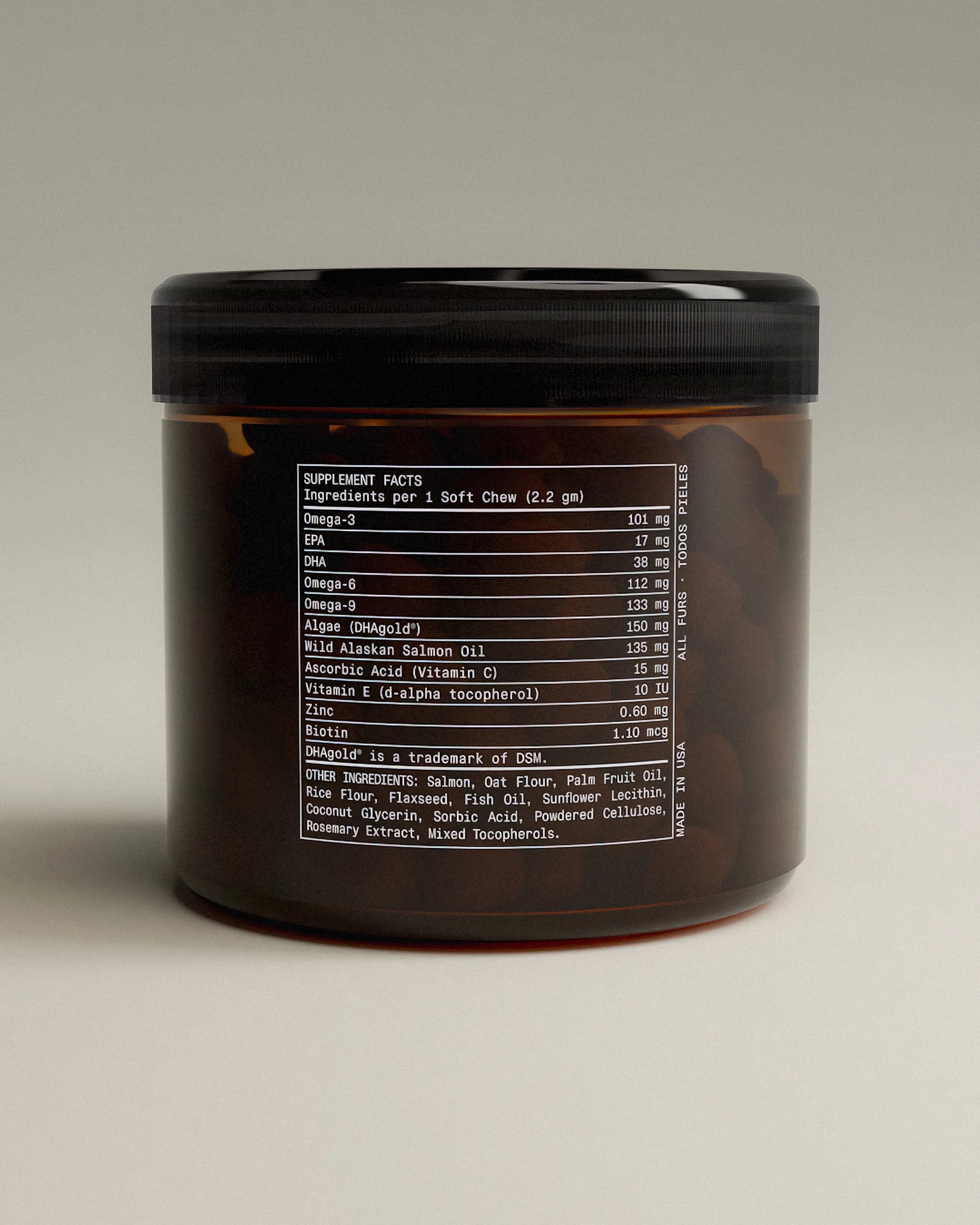 Black container with nutritional information on a beige background