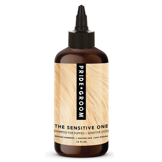 Bottle of 'Pride & Groom The Sensitive One' shampoo for dogs on a white background