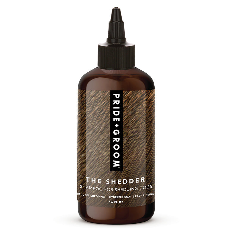Dog shampoo bottle labeled 'The Shedder' by Pride Groom on a white background