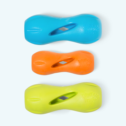 Three colorful dog toys in blue, orange, and green on a white background