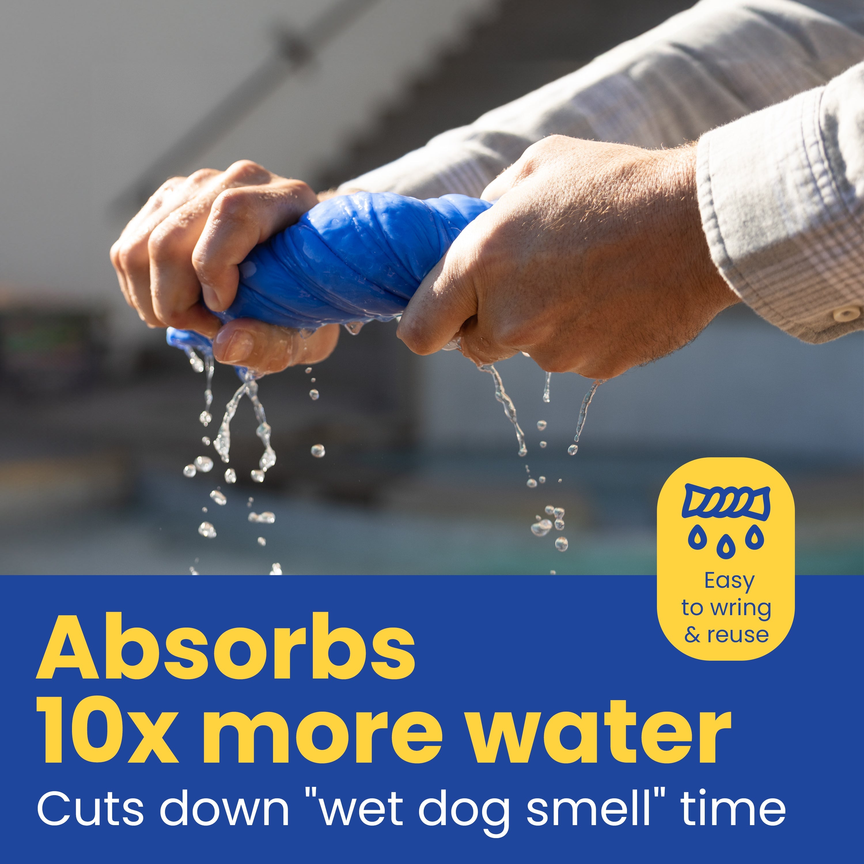 Person holding a blue product with water dripping, against a blurred outdoor background.