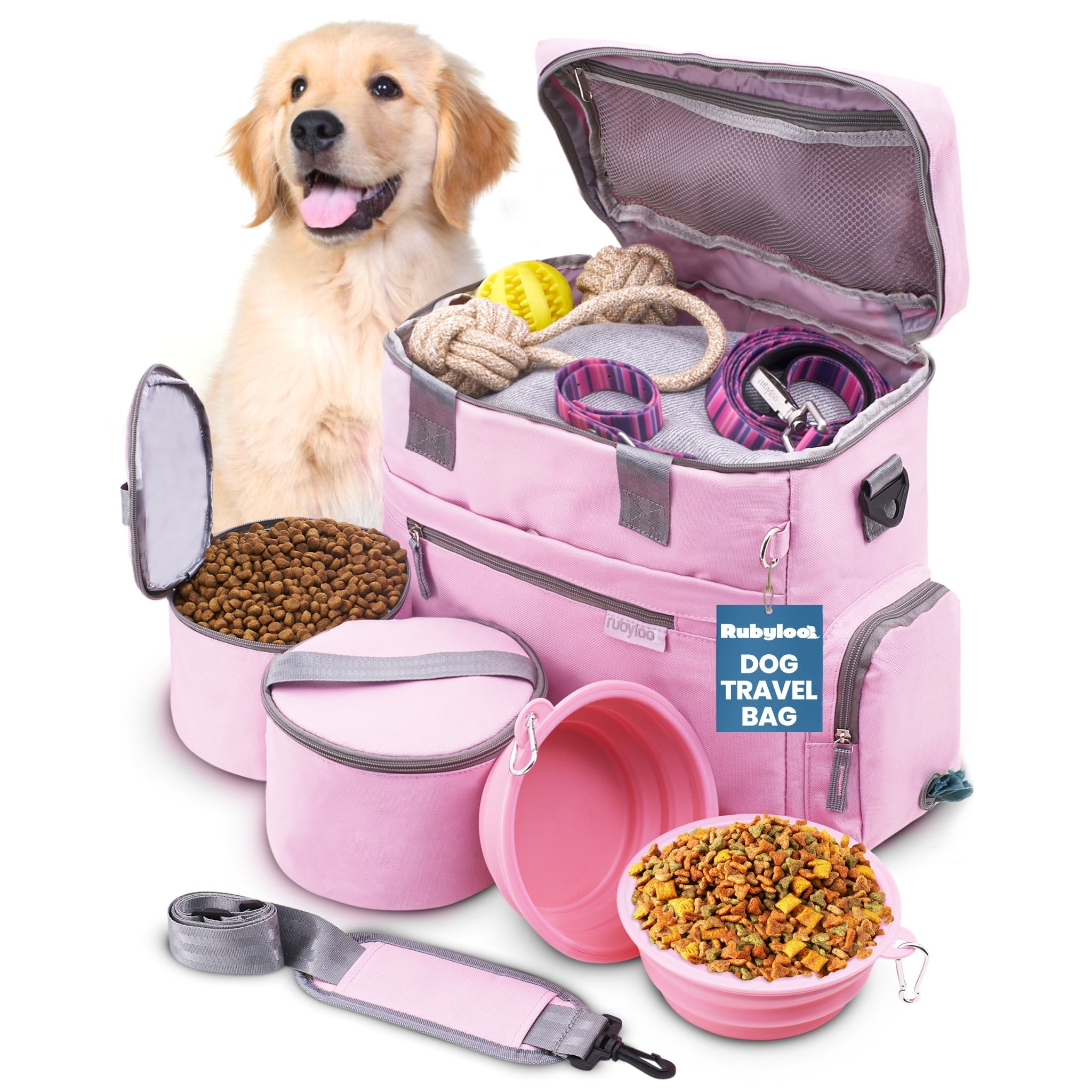 Pink dog travel bag with pet supplies including a bowl, leash, and food container on a white background.