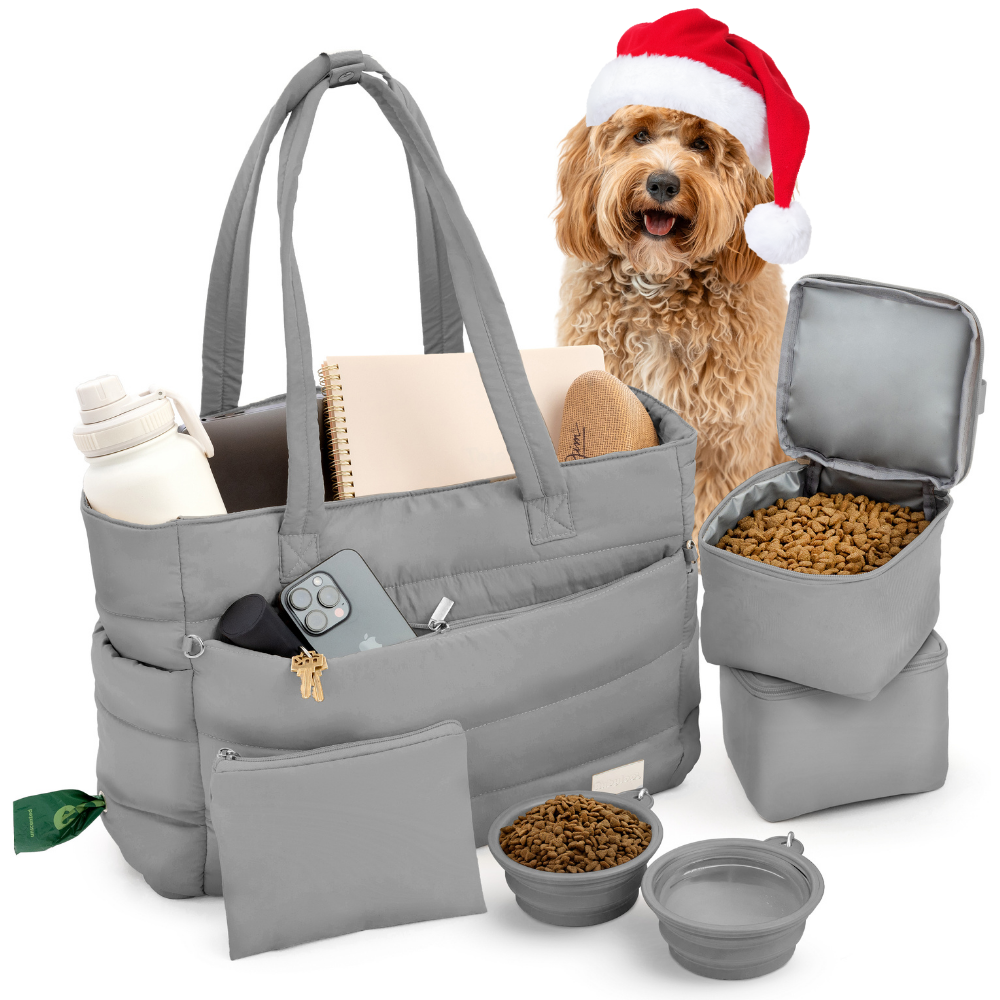 Gray pet travel bag with accessories, including a dog wearing a Santa hat.