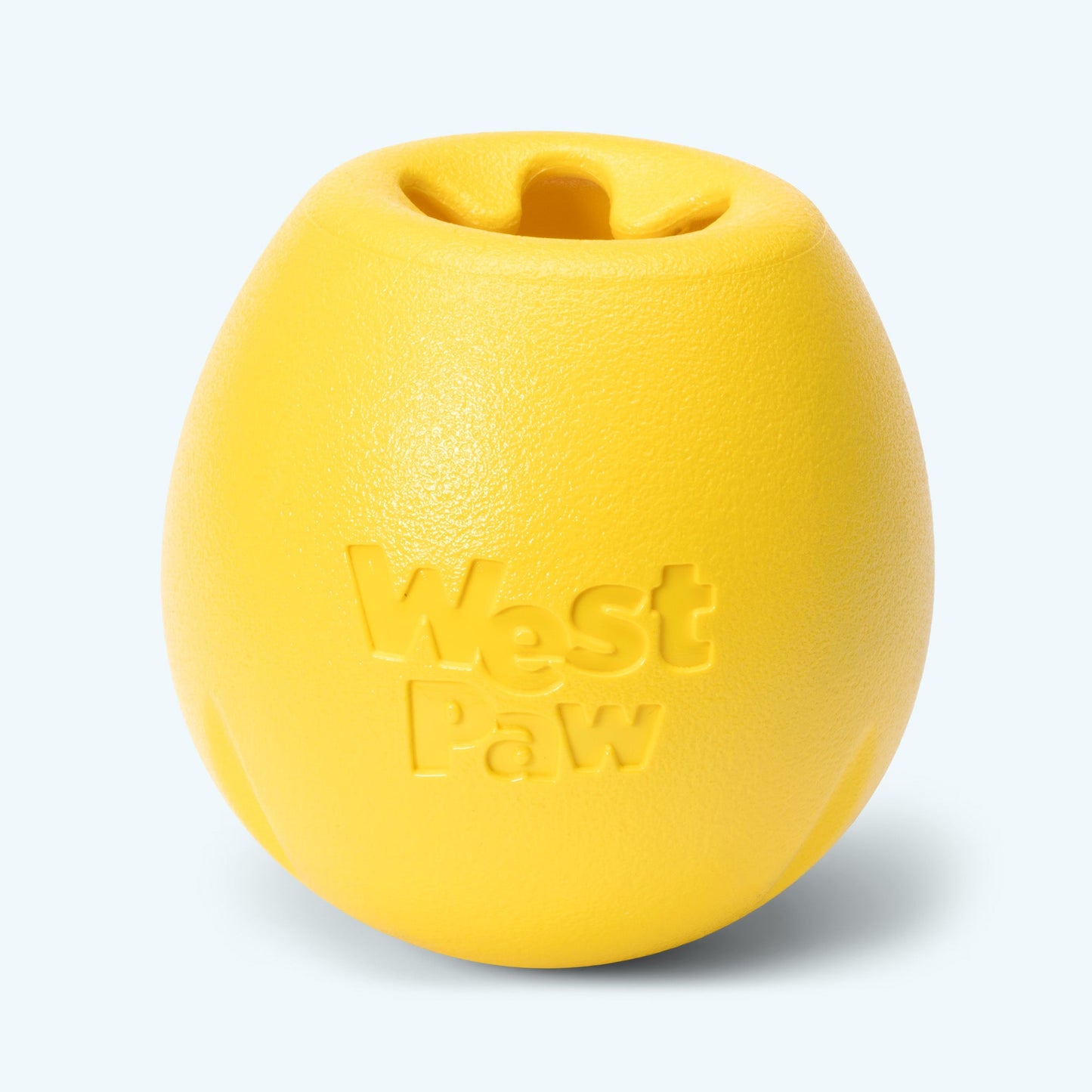 Yellow dog toy with 'West Paw' branding on a light gray background