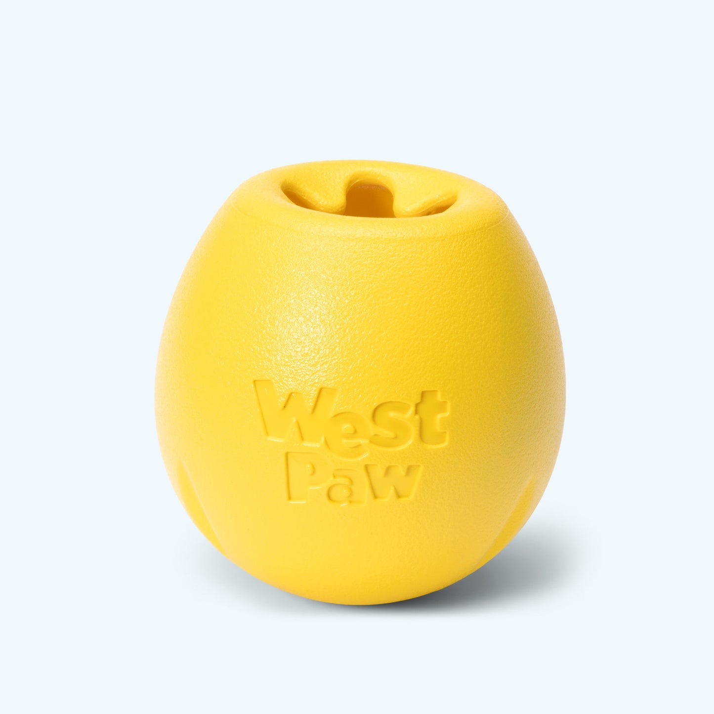 Yellow dog toy with 'West Paw' branding on a light gray background