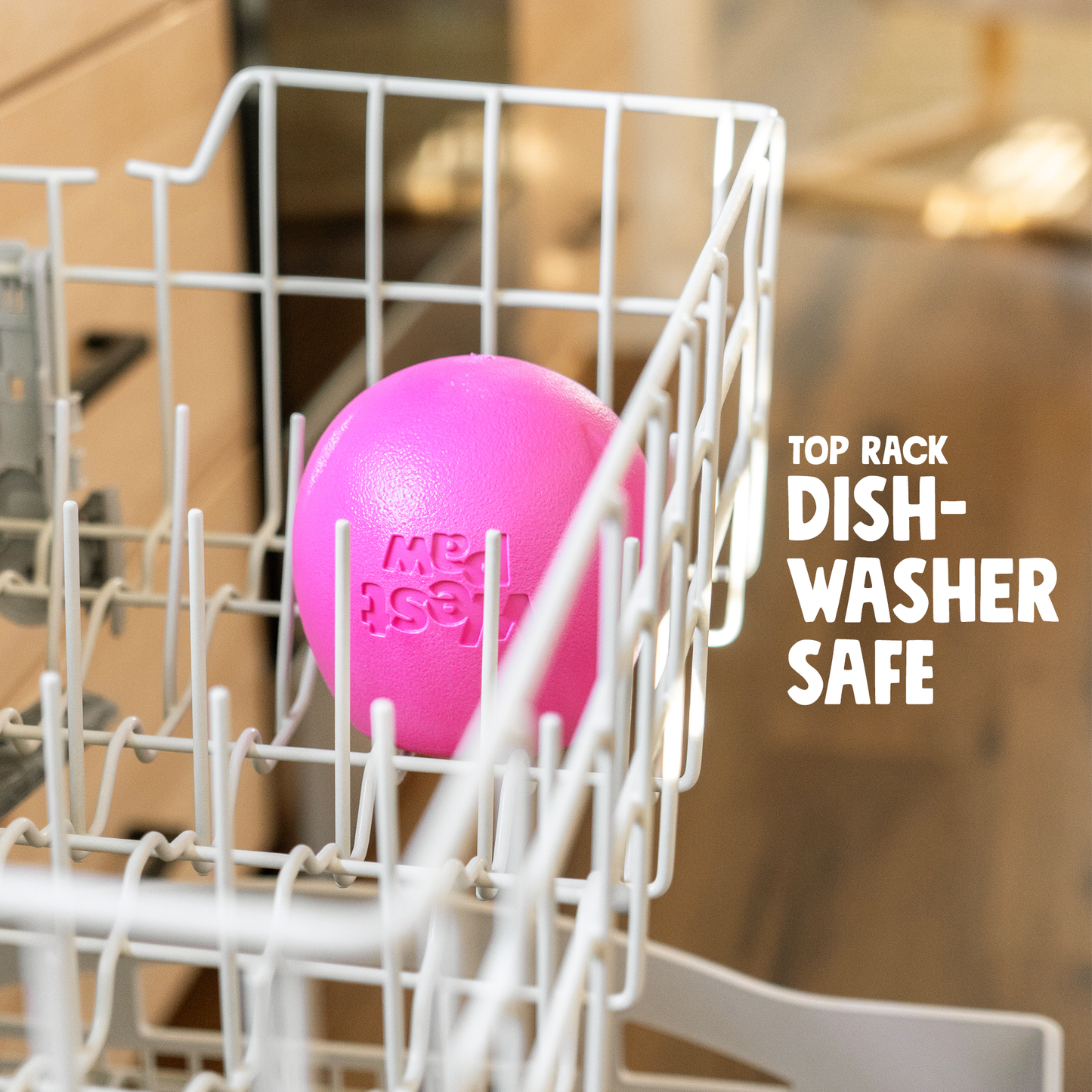 Pink ball with 'MB Asst' branding in a dishwasher rack, labeled 'Top Rack Dishwasher Safe'.