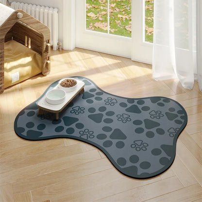 Gray paw print rug on a wooden floor with a pet play area in the background.