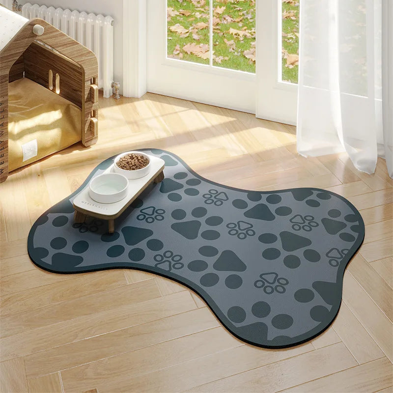 Gray paw print rug on a wooden floor with a pet play area in the background.