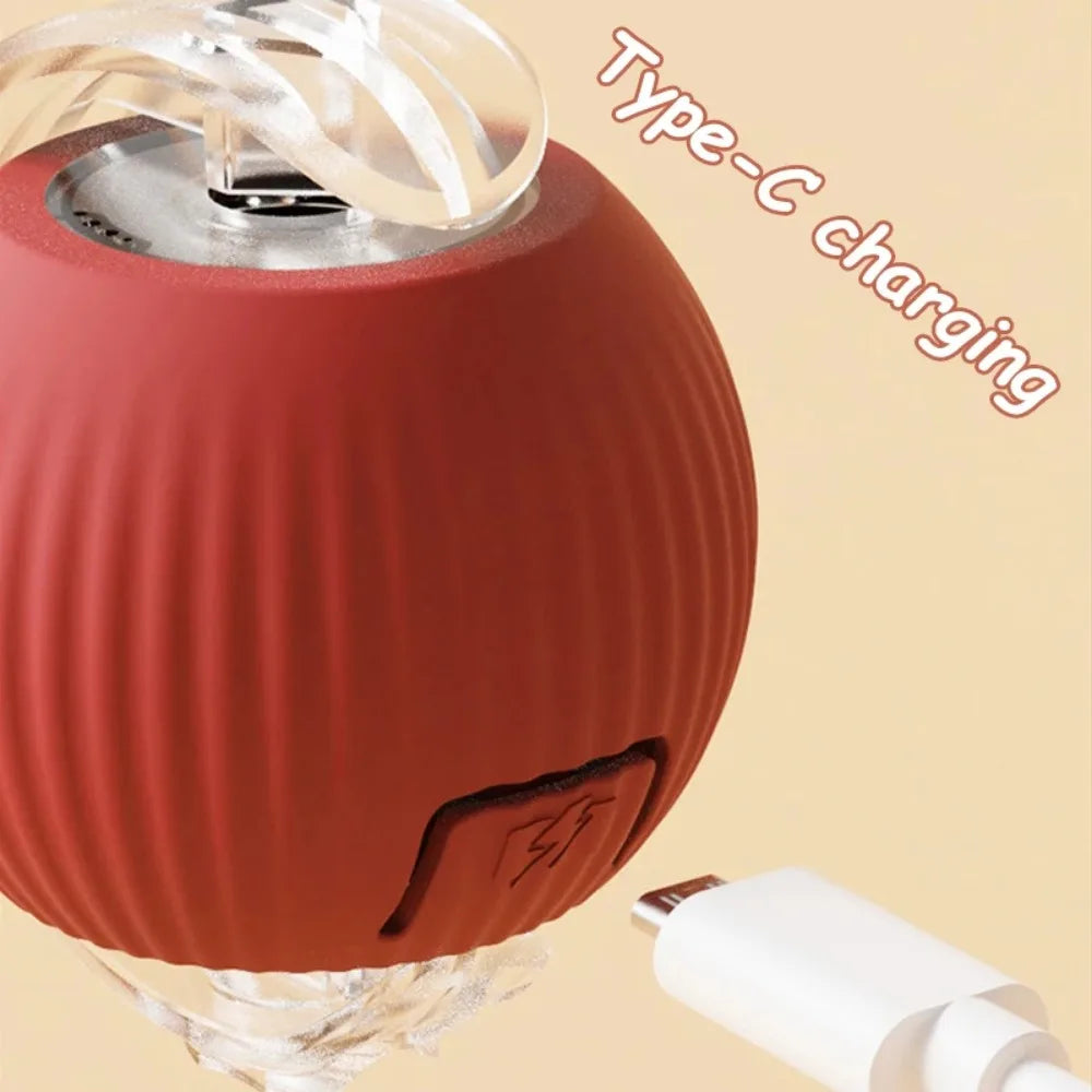 Red portable speaker with Type-C charging cable on a beige background