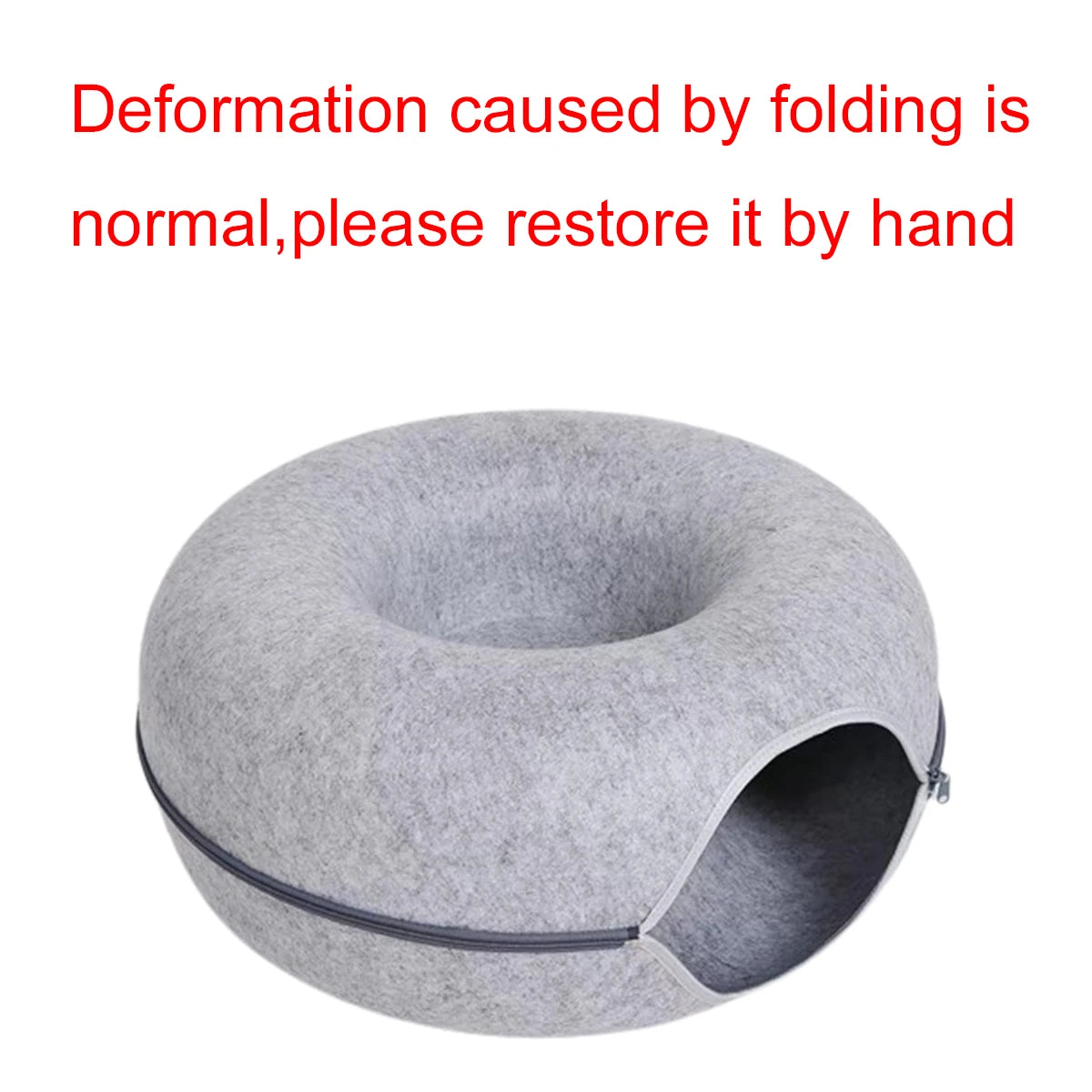 Gray pet house with text indicating normal folding deformation and instructions to restore it by hand on a white background.