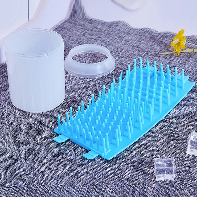 Blue plastic rack on a textured surface with a white container and yellow flower in the background.