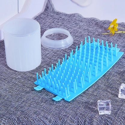 Blue plastic rack on a textured surface with a white container and yellow flower in the background.