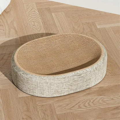 Round cat bed with sisal-wrapped rim on a wooden floor