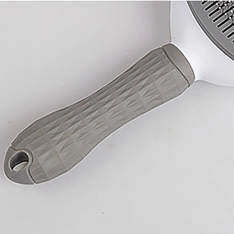 Close-up of a kitchen spatula with a gray handle on a white background