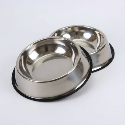 Two stainless steel dog bowls on a white background