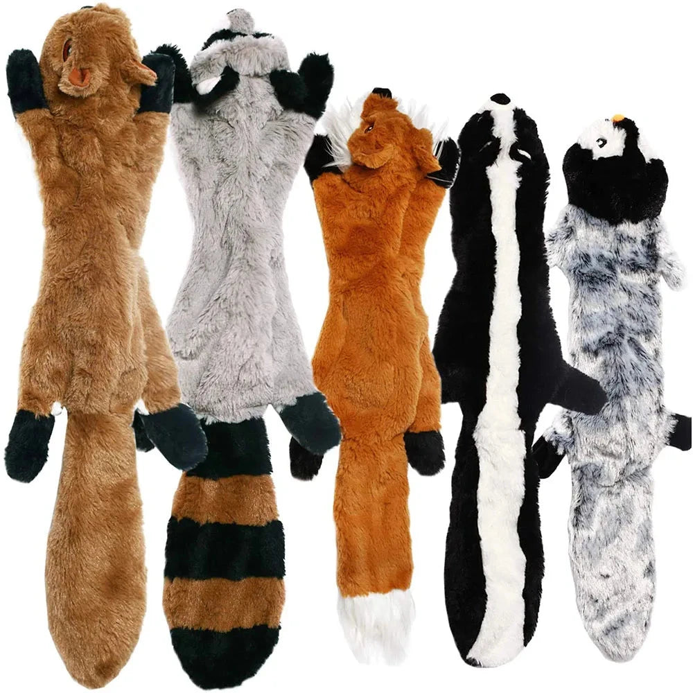 Set of plush animal toys resembling raccoons, foxes, and skunks on a white background