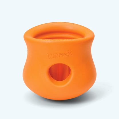 Orange dog toy with a central hole on a white background
