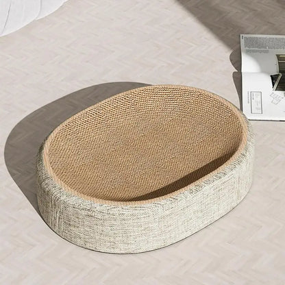 Round woven cat bed on a light-colored floor with a newspaper in the background