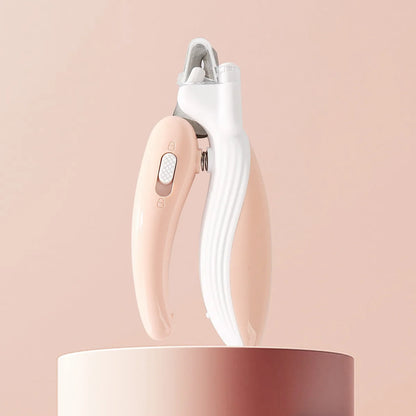 White and rose gold electronic device on a pink background