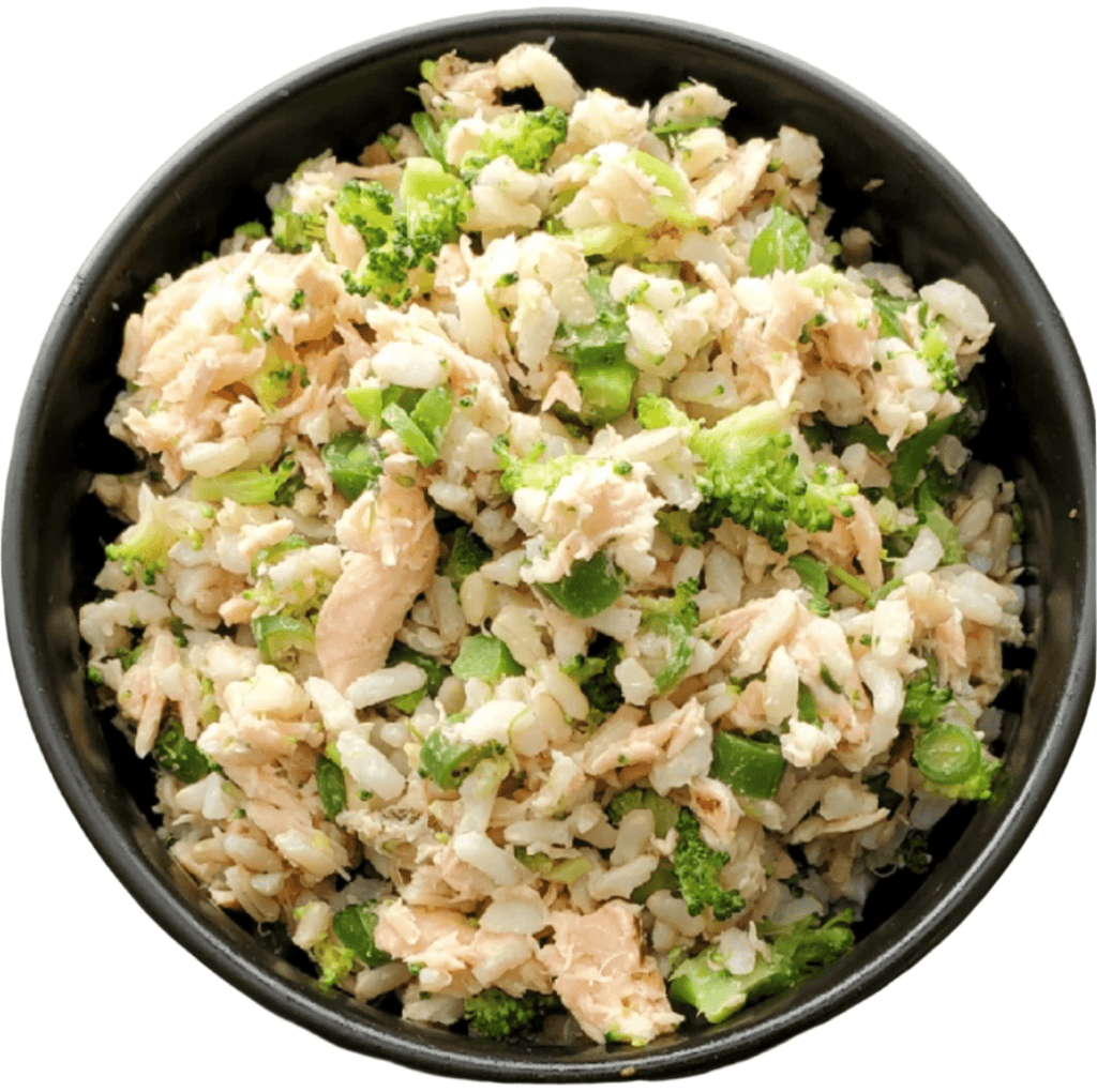 Black bowl filled with a rice dish containing chicken and broccoli on a white background