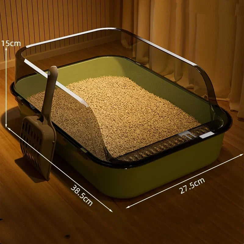 Green cat litter box with dimensions on a wooden floor