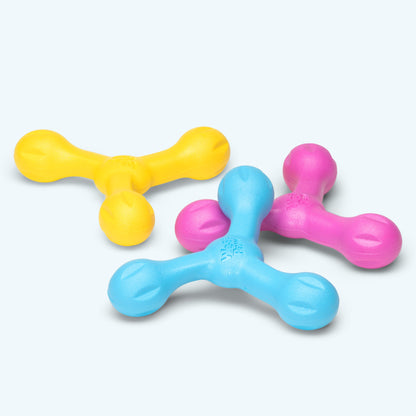 Three colorful plastic toys on a white background