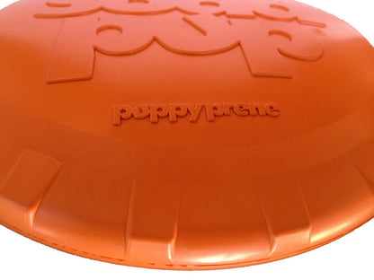 Orange dog toy with 'Puppy Prene' branding on a white background