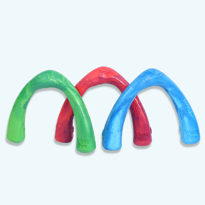 Three colorful arch-shaped toys on a light gray background