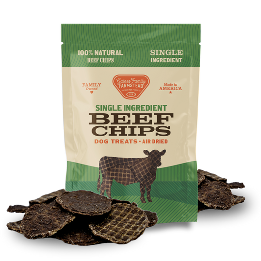 Package of single ingredient beef chips dog treats with visible beef chips on a white background