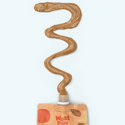 West Paw dog treat packaging with a wavy line of brown treat on a white background