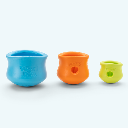 Three colorful silicone cups on a white background