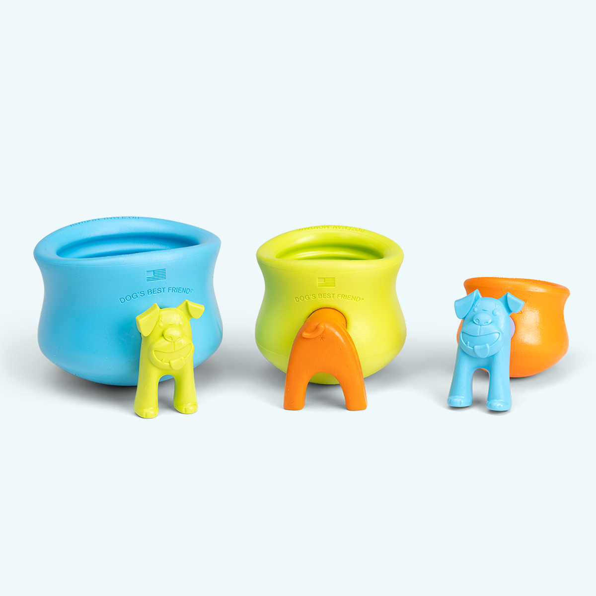 Three colorful silicone dog bowls in blue, green, and orange on a white background.