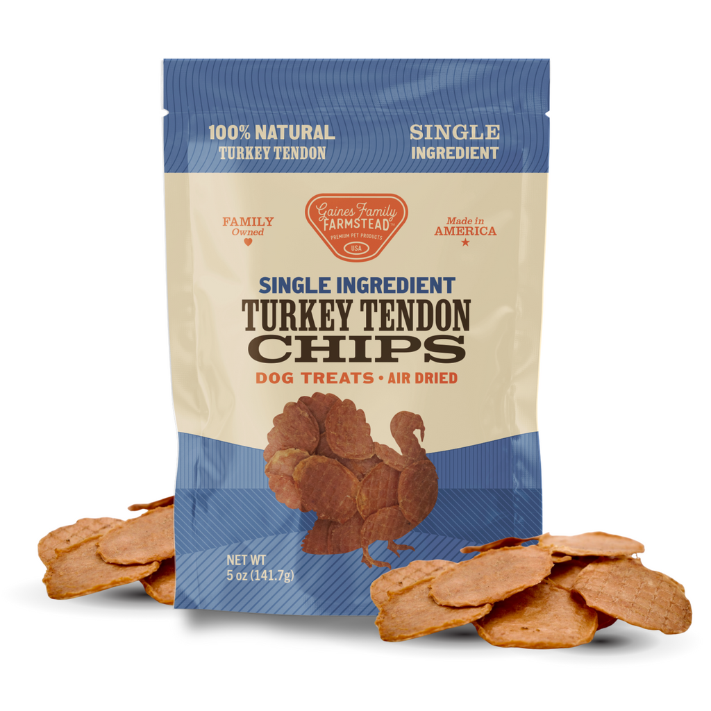 Package of single ingredient turkey tendon chips for dogs with visible treats on a white background