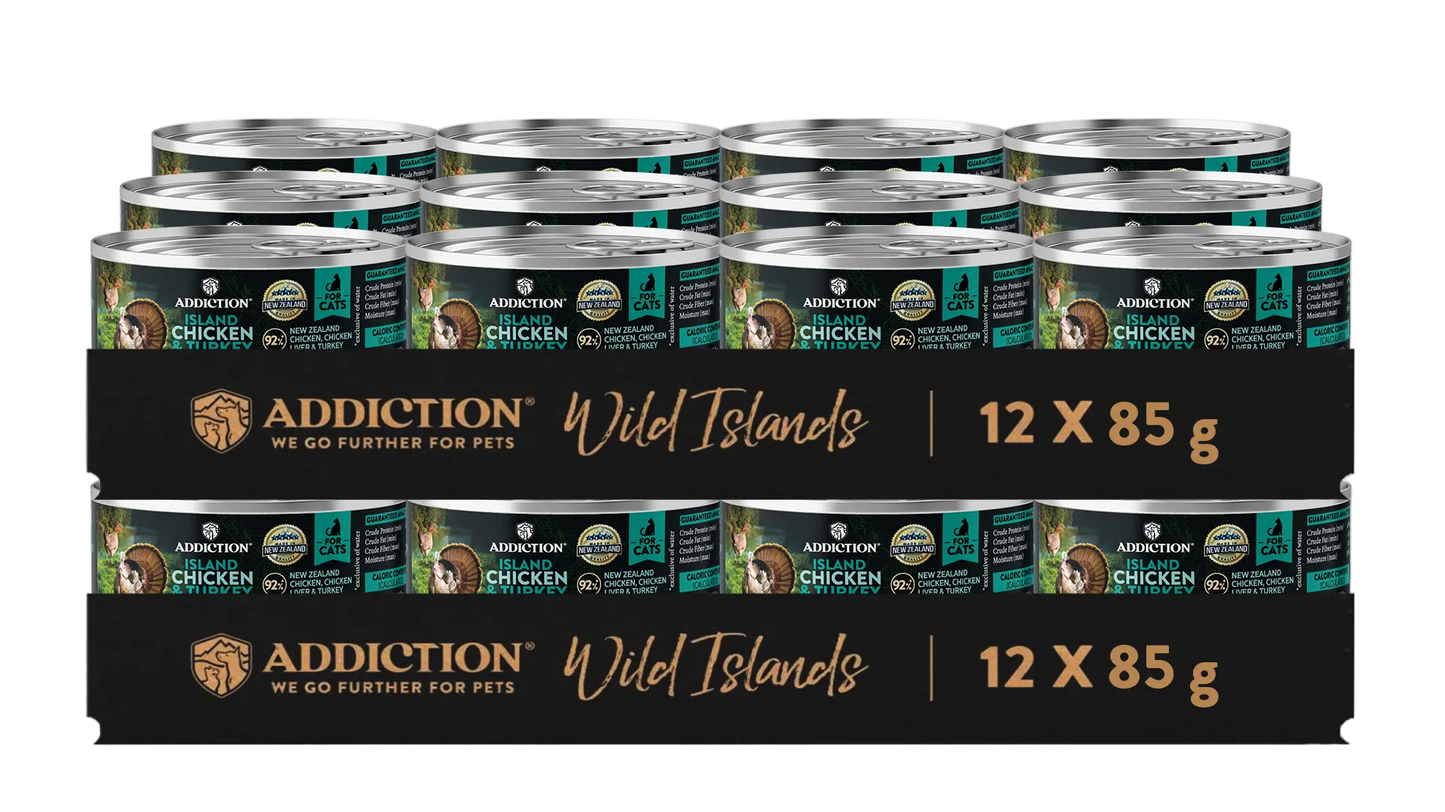 Multiple cans of Addiction Wild Islands chicken cat food on a white background