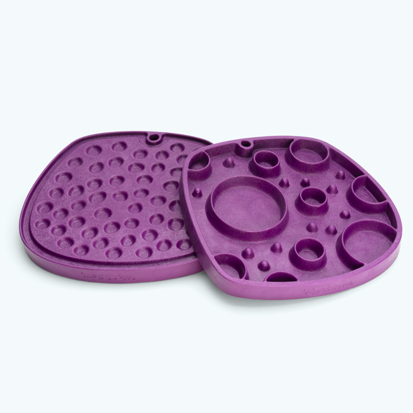 Purple silicone mold with various shapes on a white background