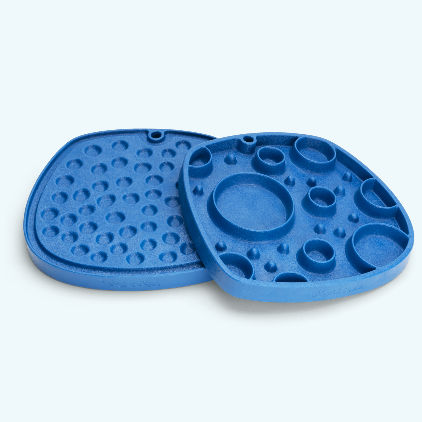 Blue silicone mold with various shapes on a light gray background