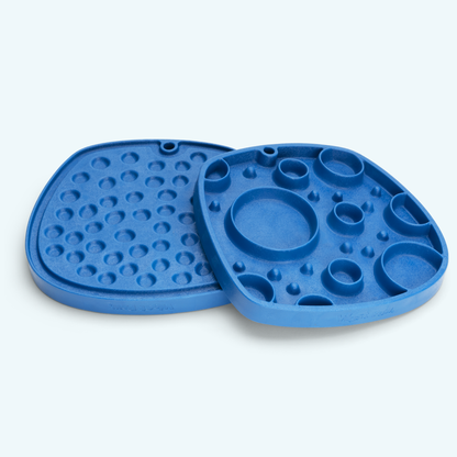 Blue silicone mold with various shapes on a light gray background